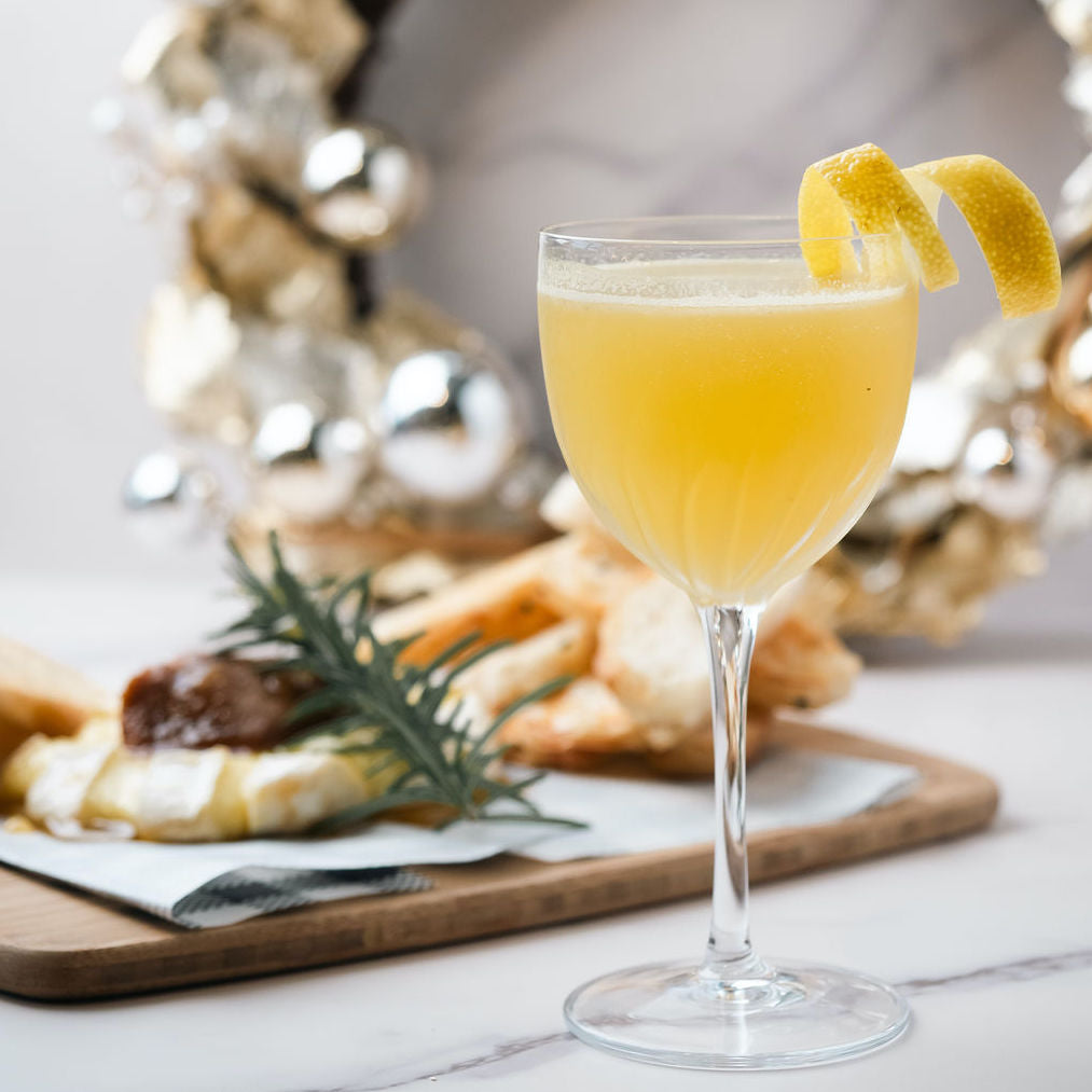 Bass & Flinders distillery citrus fields spiced christmas brandy cocktail in nick nora glass garnished with lemon